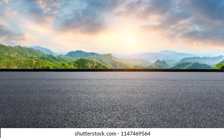 Empty asphalt square and mountain natural scenery - Shutterstock ID 1147469564