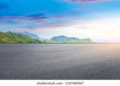 Empty asphalt square and mountain natural scenery - Shutterstock ID 1147469567