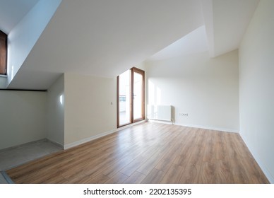 Empty Attic Room Of Modern House