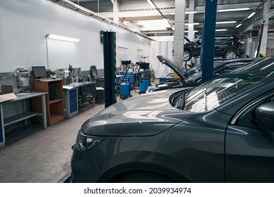 Empty Auto Repair Shop With Many Cars