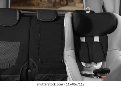 Empty baby seat inside car. Child safety
