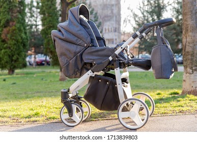 Empty baby stroller for boys in the park. 