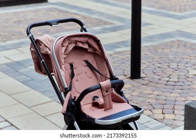 Empty Baby Stroller Near The Open Entrance To The Store.