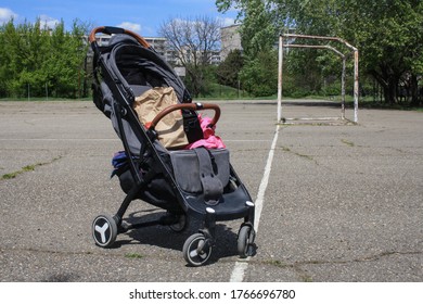 Empty Baby Stroller On The Playground