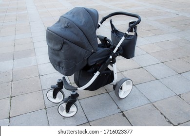 Empty Baby Stroller In The Park. 