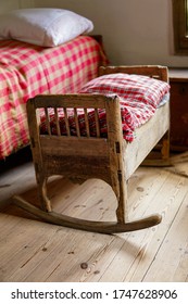 Empty Baby Wooden Old Vintage Cradle On Floor