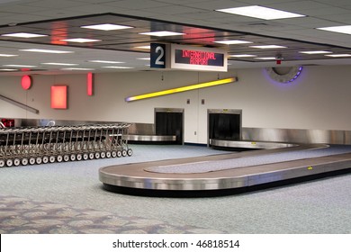 Empty Baggage Claim Carousel.  International Airport.  Baggage Cars.  Waiting For The Plane To Land And Unload.