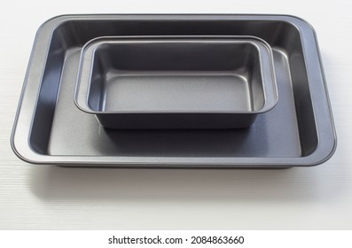 Empty Baking Sheet On White Wooden Table