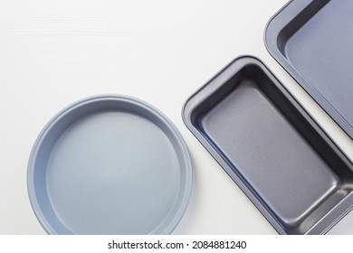 Empty Baking Sheet On White Wooden Table