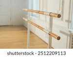 Empty ballet dance studio with barre. Professional ballet barre for stretching practicing dancing positions in dance school Dance hall ready for ballet class training. Ballet school