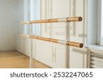 Empty ballet dance studio with barre. Professional ballet barre for stretching practicing dancing positions in dance school Dance hall ready for ballet class training. Ballet school