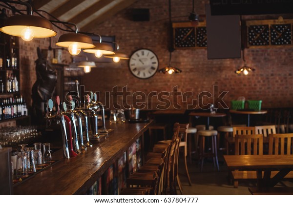 Empty bar counter at\
pub