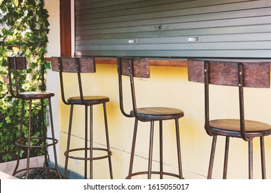 Empty bar - bar stools at the closed bar counter. Small business fail concept