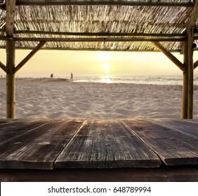 Empty Bar Table Against Sunset At The Beach