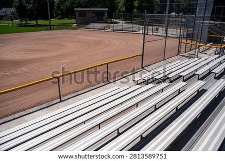 Empty baseball diamond viewed from stadium bleachers.