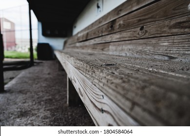 An Empty Baseball Dugout Bench