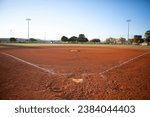 Empty baseball field view from home plate, late afternoon light