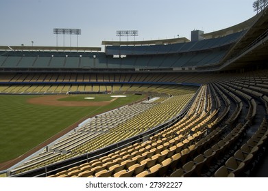 An empty baseball stadium being prepared for the opening day of a new season.