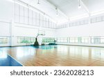 Empty basketball court in a school gym.