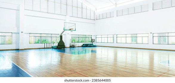 Empty basketball court in a school gym.