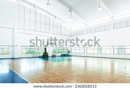 Empty basketball court in a school gym.