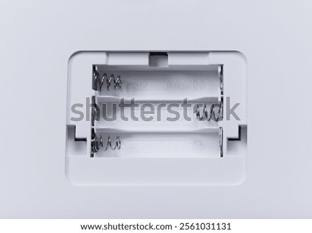Empty battery compartment in an electronic device. Close-up