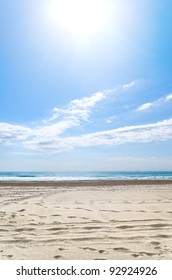 Empty Beach At Sunny Day With Footprints, Spain