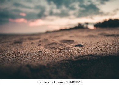 Empty Beach at the Sunset. Shallow deep of Field. Filter Applied. 