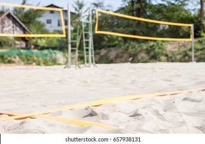 empty beach volleyball court ready to play game