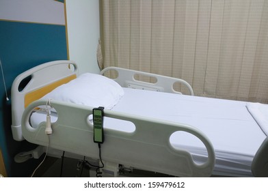Empty bed in hospital room