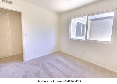 Empty bedroom in a model home in southern California - Shutterstock ID 668390410