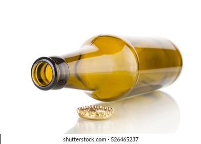 Empty beer bottle closeup on white background