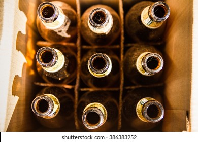 Empty Beer Bottles In Paper Cartons