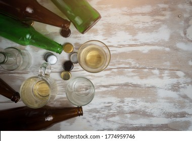 Empty Beer Glass With Bottle Caps And Bottles,after Party,top View