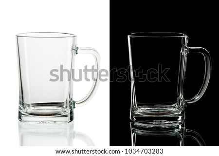 Empty beer glass with handle on black and white background, isolated