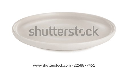 Empty beige ceramic plate isolated on white