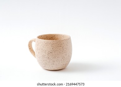 Empty beige coffee ceramic cup on isolated white background, cut out. - Shutterstock ID 2169447573