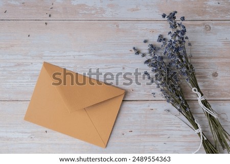 Empty beige envelope paper template mock up. Copy space for your text. Lavender flower. Greeting or invitation card blank with envelope