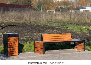 Empty Bench In The Alley Of The City Park. Empty Park Bench. High Quality Photo