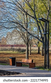 Empty Bench In The Alley Of The City Park. Empty Park Bench (Corrected).