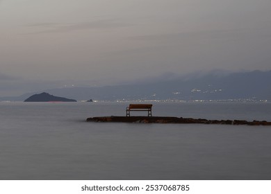 Empty bench by the sea. Long exposure photo. - Powered by Shutterstock