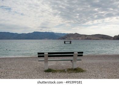 empty bench on the beach , Baska , Croatia