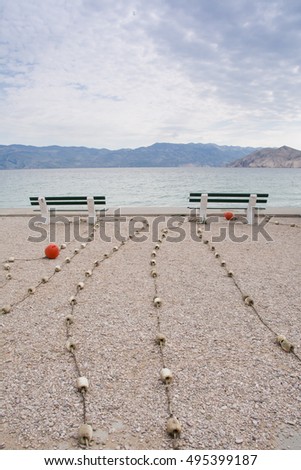 empty bench on the beach , Baska , Croatia