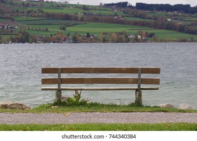An empty bench on the lake side
