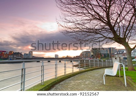 Empty bench at Shannon river, Limerick, Ireland