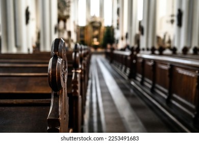 Empty benches in cathedral close up view. Church before the worship. - Shutterstock ID 2253491683