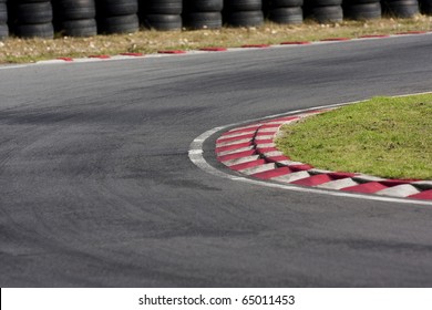 An Empty Bend On A Race Car Circuit.