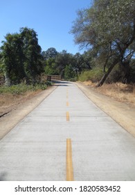 Empty Bike Trail Near Stream