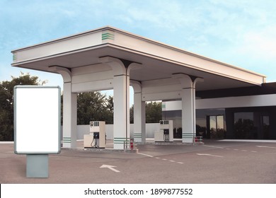 Empty billboard on modern gas station outdoors, space for design
