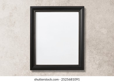 Empty black frame on a textured wall. The frame is black, simple, and empty. Perfect for art, photos, or certificates. Black frame on a neutral background. Blank picture frame on wall.